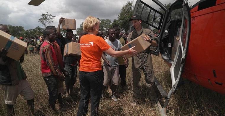 World Vision CEO Claire Rogers helps deliver aid to an isolated community of Beira, Mozambique.